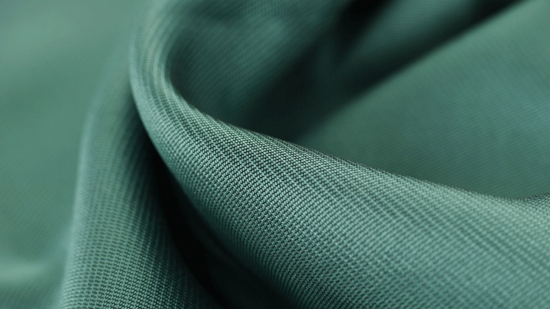 Sino Finetex factory capability and quality-control area where fabric stretch and recovery are checked